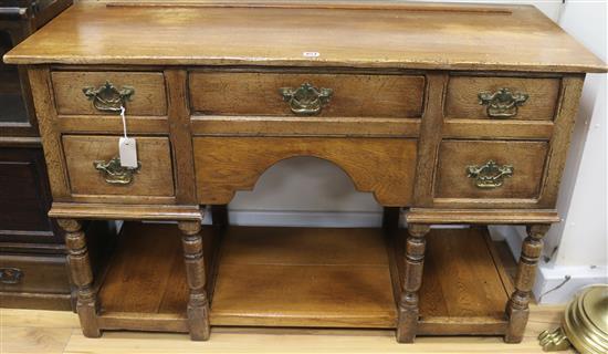 A oak dresser base. W.122cm